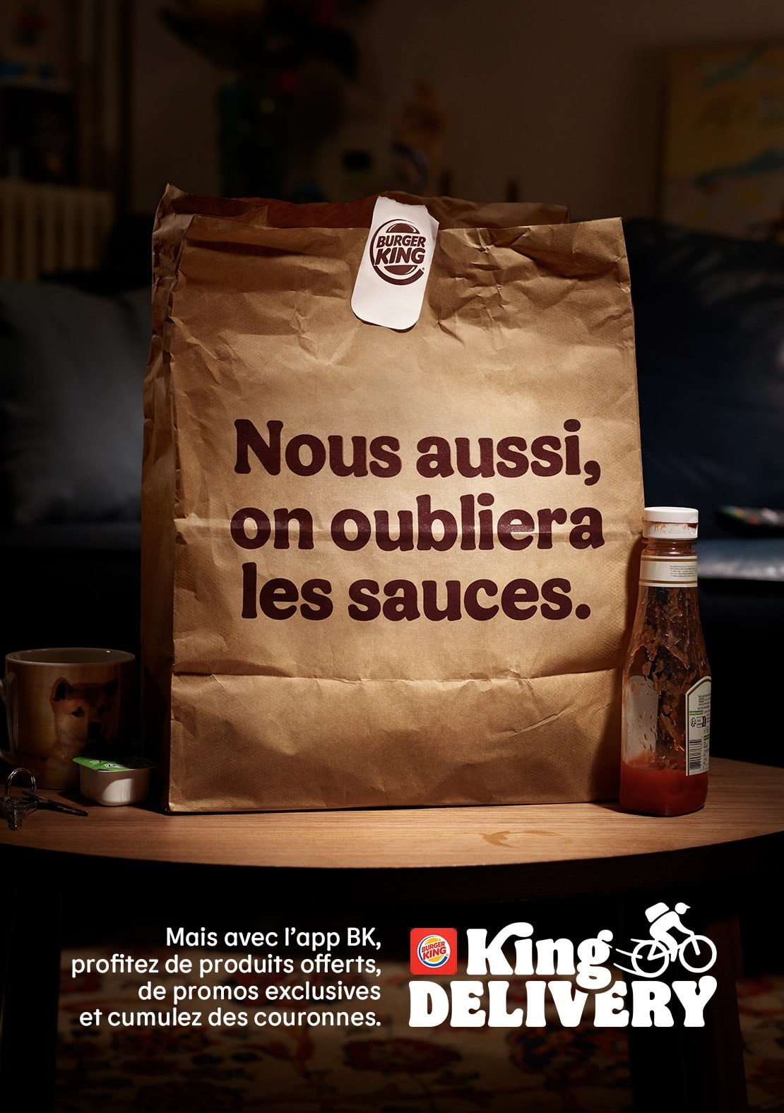 Affiche « Nous aussi, on oubliera les sauces. » : sac Burger King et bouteille de ketchup vide